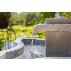 Resin Outdoor Floor Fountain Perfectly Centered in the Middle of a Flowerbed Fountain will Bring the Relaxing Sounds of Water