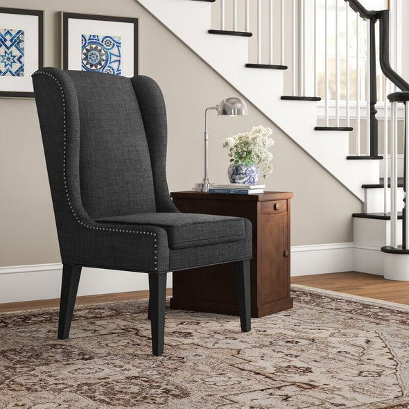 Wingback Chair Adds Stately Style To Any Living Room Or Den. Its Solid and Wood Frame is Founded Atop Four Tapered Legs